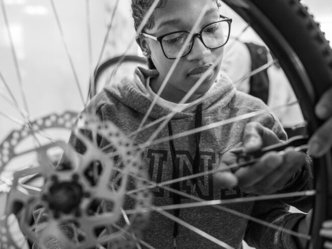 How does a school’s bike tech program contribute to students’ overall development and success in the future?